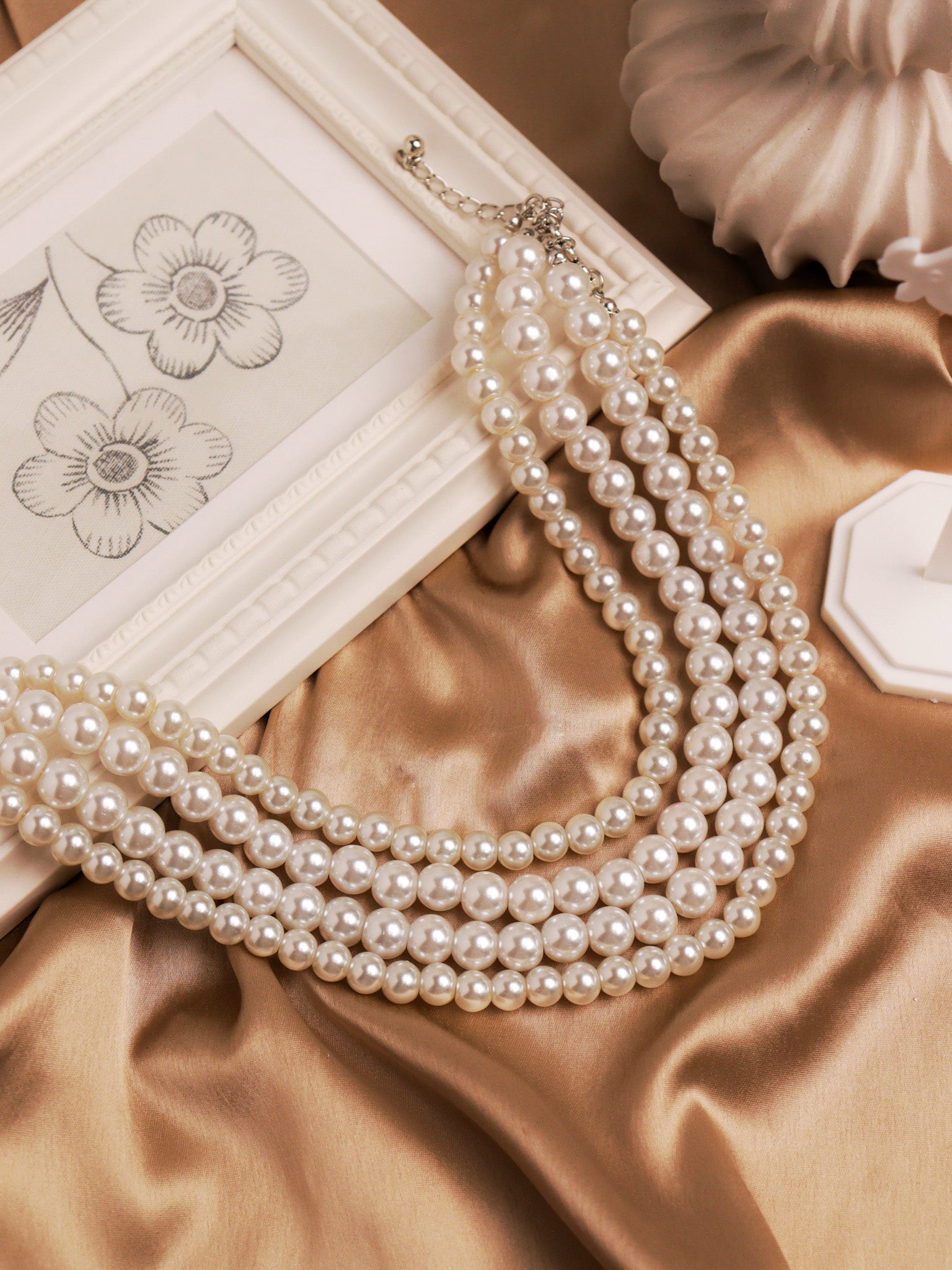 The Pearl Story - Ivory Strings of Oyster Necklace